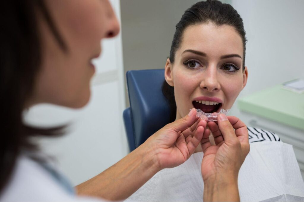 dentist assessing patients teeth